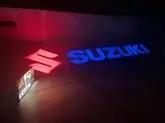 Pair of Authentic Illuminated Suzuki Dealership Signs